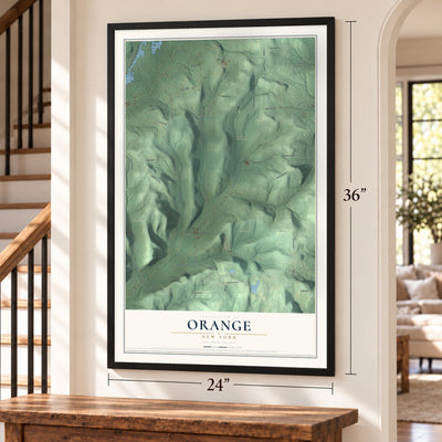 Orange, New York map, 24 x 36 inch print in a black frame by a staircase