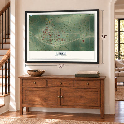 Leeds, North Dakota map, 24 x 36 inch print in a black frame above a dresser by a staircase