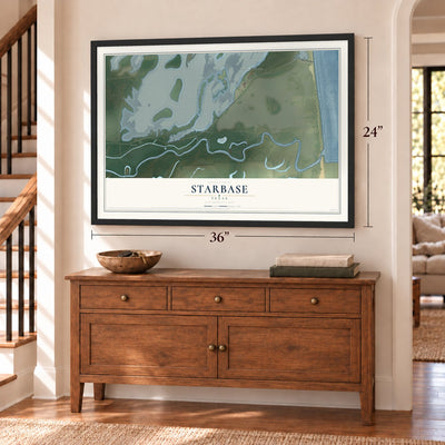 Starbase, Texas map, 24 x 36 inch print in a black frame above a dresser by a staircase