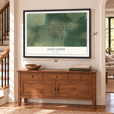 East Lynne, Missouri map, 24 x 36 inch print in a black frame above a dresser by a staircase