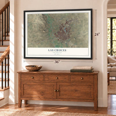 Las Cruces, New Mexico map, 24 x 36 inch print in a black frame above a dresser by a staircase