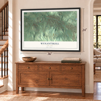 Wynantskill, New York map, 24 x 36 inch print in a black frame above a dresser by a staircase