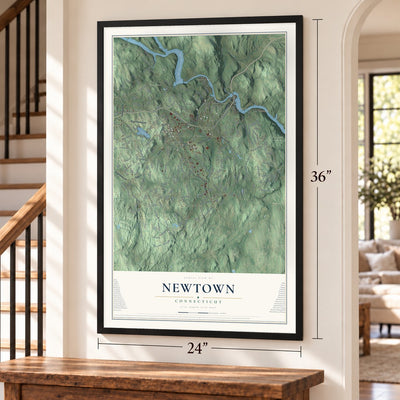 Newtown, Connecticut map, 24 x 36 inch print in a black frame by a staircase