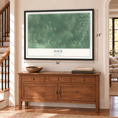Slick, Oklahoma map, 24 x 36 inch print in a black frame above a dresser by a staircase