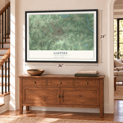 Gaffney, South Carolina map, 24 x 36 inch print in a black frame above a dresser by a staircase