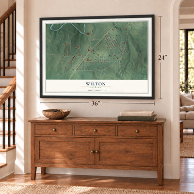 Wilton, Alabama map, 24 x 36 inch print in a black frame above a dresser by a staircase