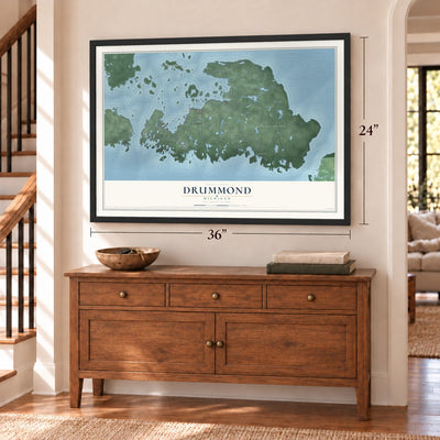 Drummond, Michigan map, 24 x 36 inch print in a black frame above a dresser by a staircase