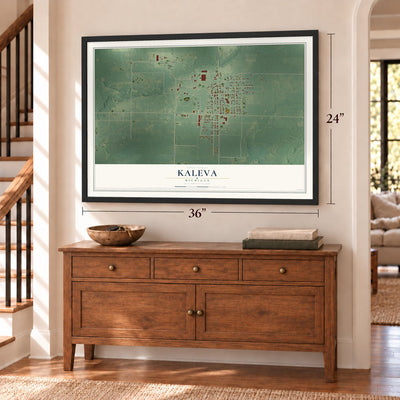 Kaleva, Michigan map, 24 x 36 inch print in a black frame above a dresser by a staircase