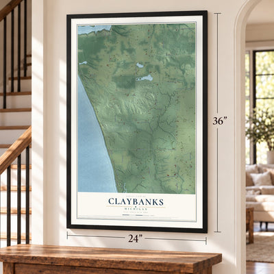 Claybanks, Michigan map, 24 x 36 inch print in a black frame by a staircase