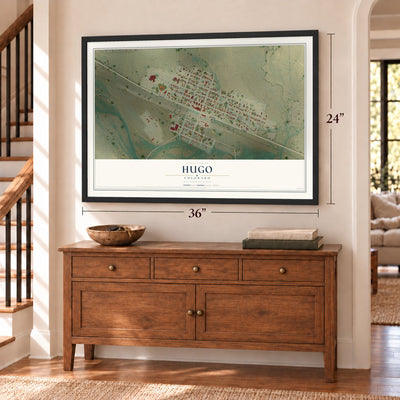 Hugo, Colorado map, 24 x 36 inch print in a black frame above a dresser by a staircase
