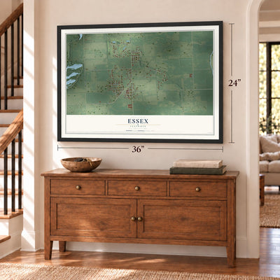 Essex, Illinois map, 24 x 36 inch print in a black frame above a dresser by a staircase