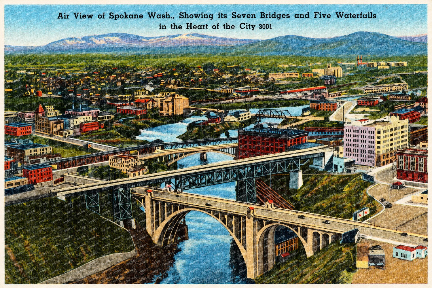 Spokane, WA: Air view of Spokane Wash., showing its seven bridges and five waterfalls in the heart of the city