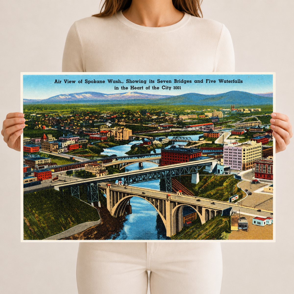 Spokane, WA: Air view of Spokane Wash., showing its seven bridges and five waterfalls in the heart of the city