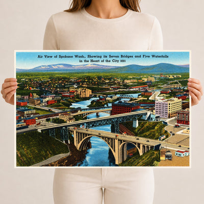 Spokane, WA: Air view of Spokane Wash., showing its seven bridges and five waterfalls in the heart of the city