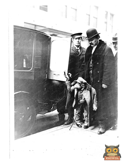 Dapper Chimpanzee by Vintage Car at Hippodrome