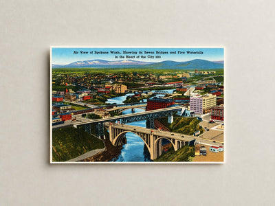 Spokane, WA: Air view of Spokane Wash., showing its seven bridges and five waterfalls in the heart of the city