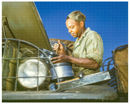 African American Soldier Working on Army Truck 1942 - Available at KNOWOL