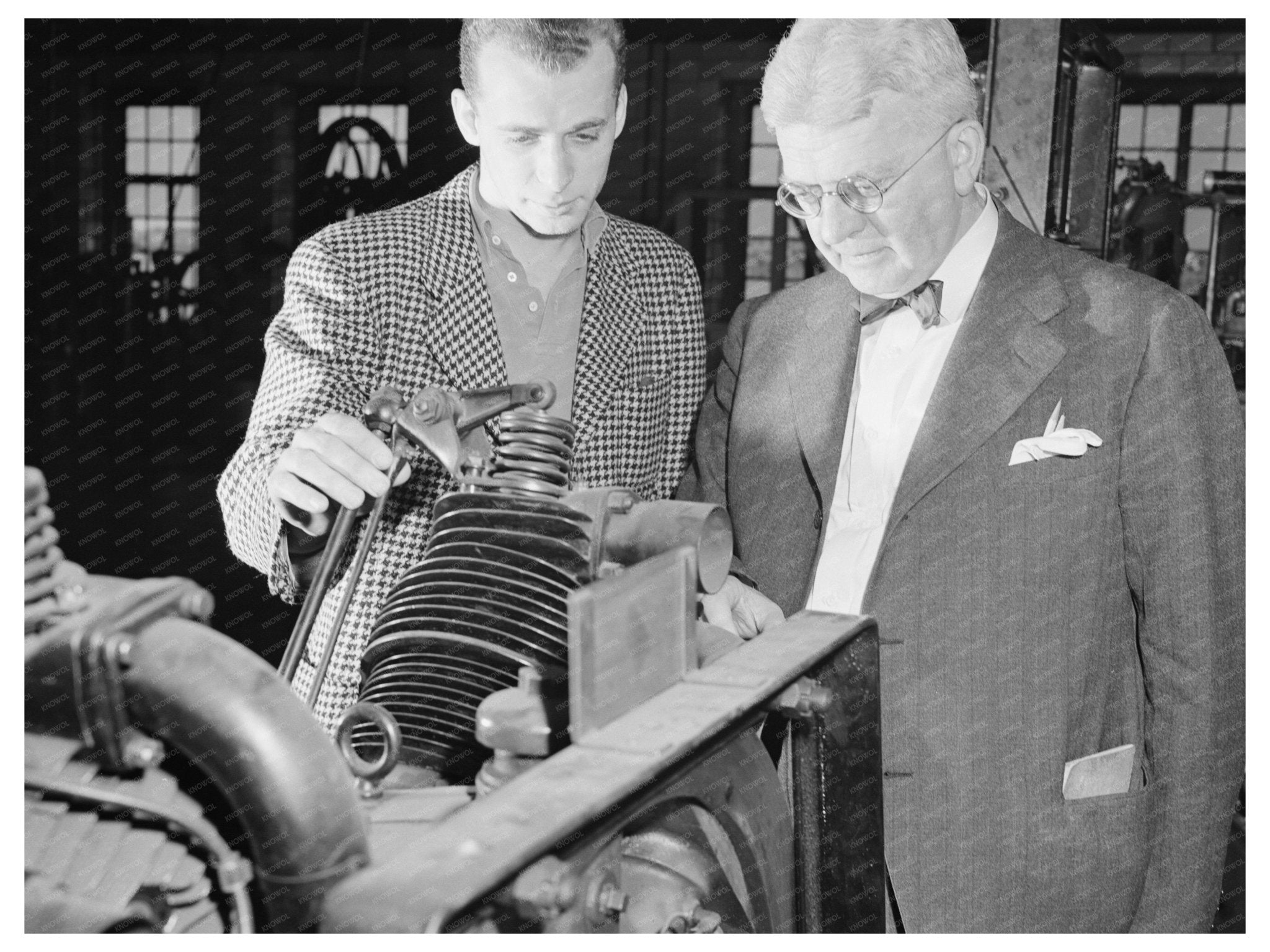 Arthur Klein and Student Examine Engine May 1944 - Available at KNOWOL