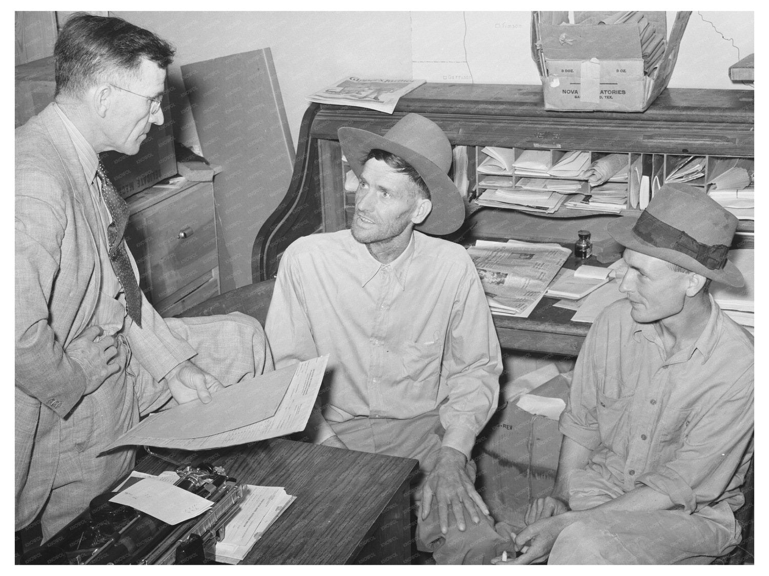 Assistant County Agent Engaging with Farmers San Augustine 1939 - Available at KNOWOL