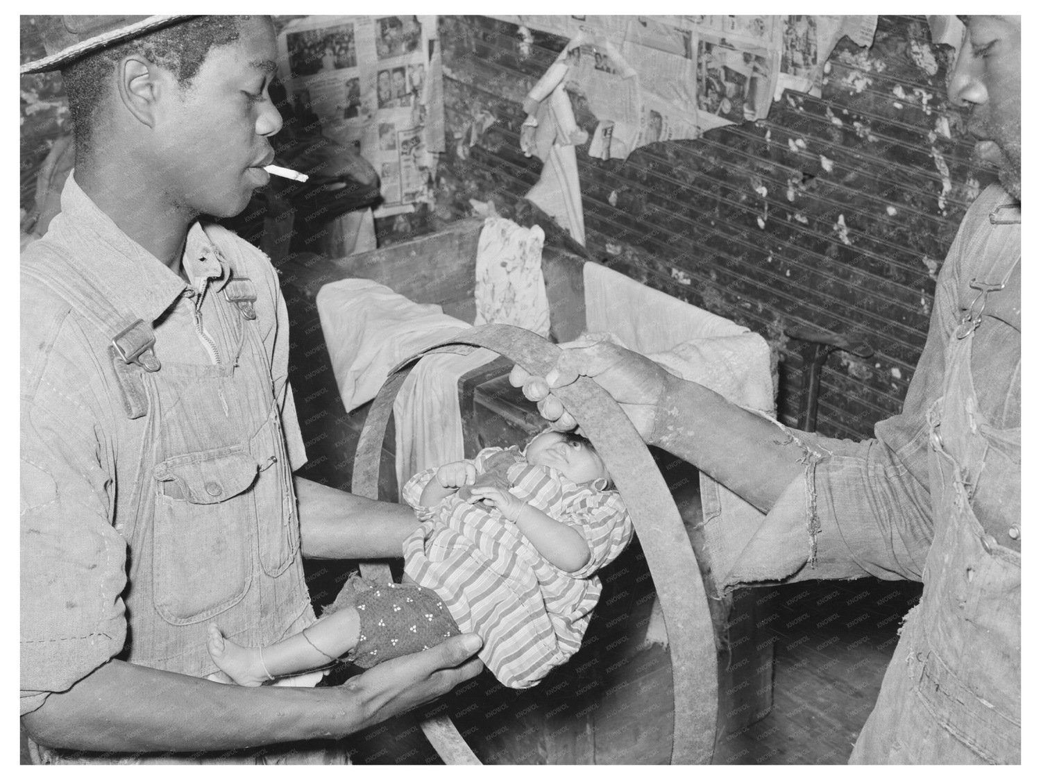 Baby Passing Through Hoop Tradition April 1939 - Available at KNOWOL