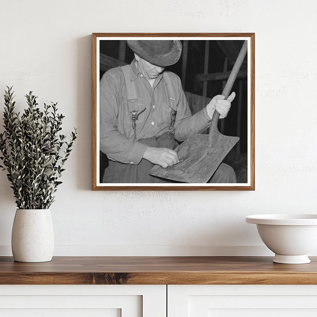 Barn Boss Cleaning Shovel at Logging Camp 1937 - Available at KNOWOL