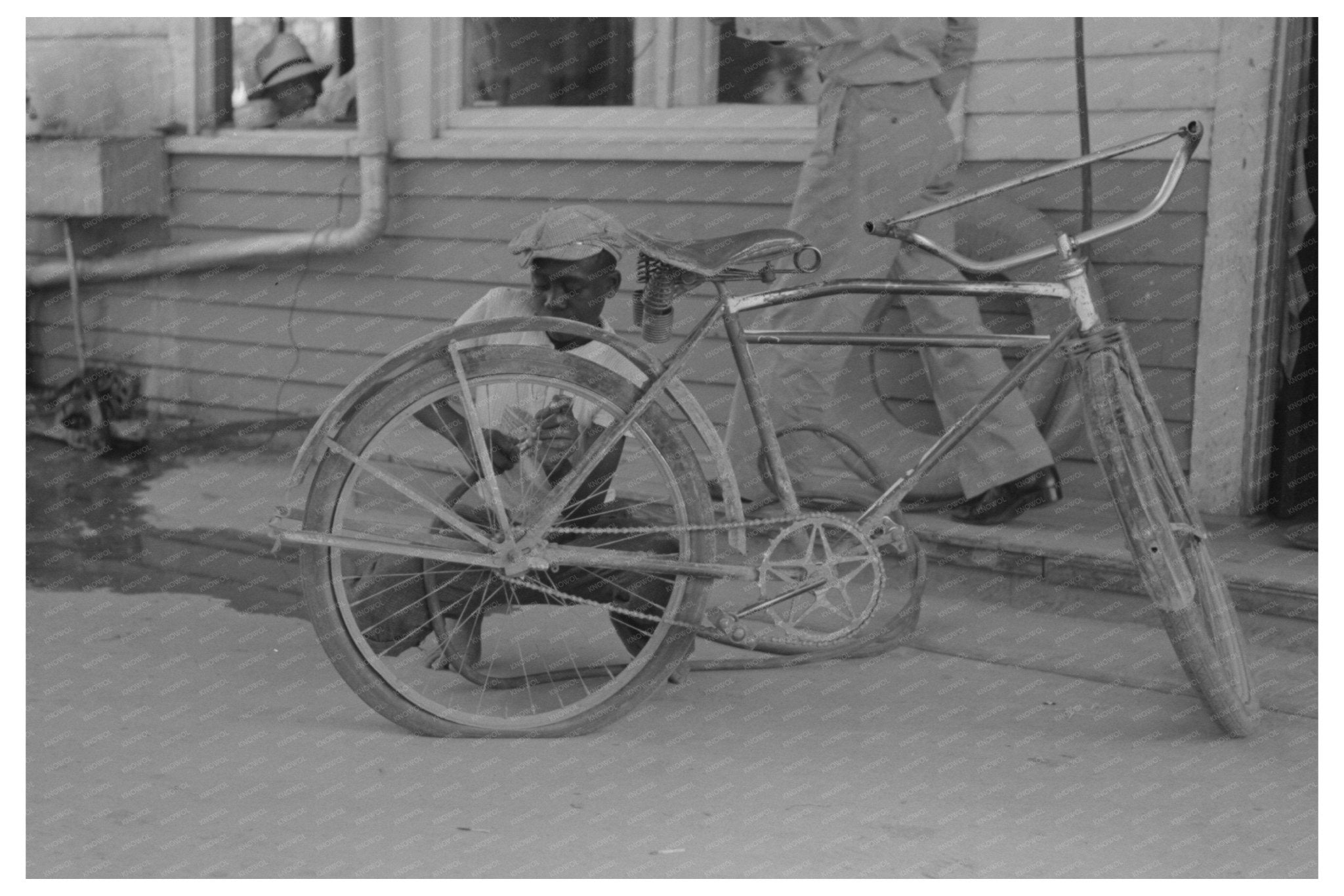 Bicycle Tire Inflation in Abbeville Louisiana 1938 - Available at KNOWOL