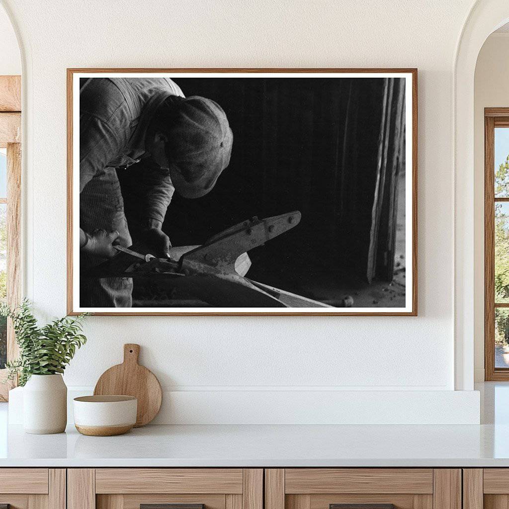 Blacksmith Helper Disassembling Plow Depew Oklahoma 1940 - Available at KNOWOL