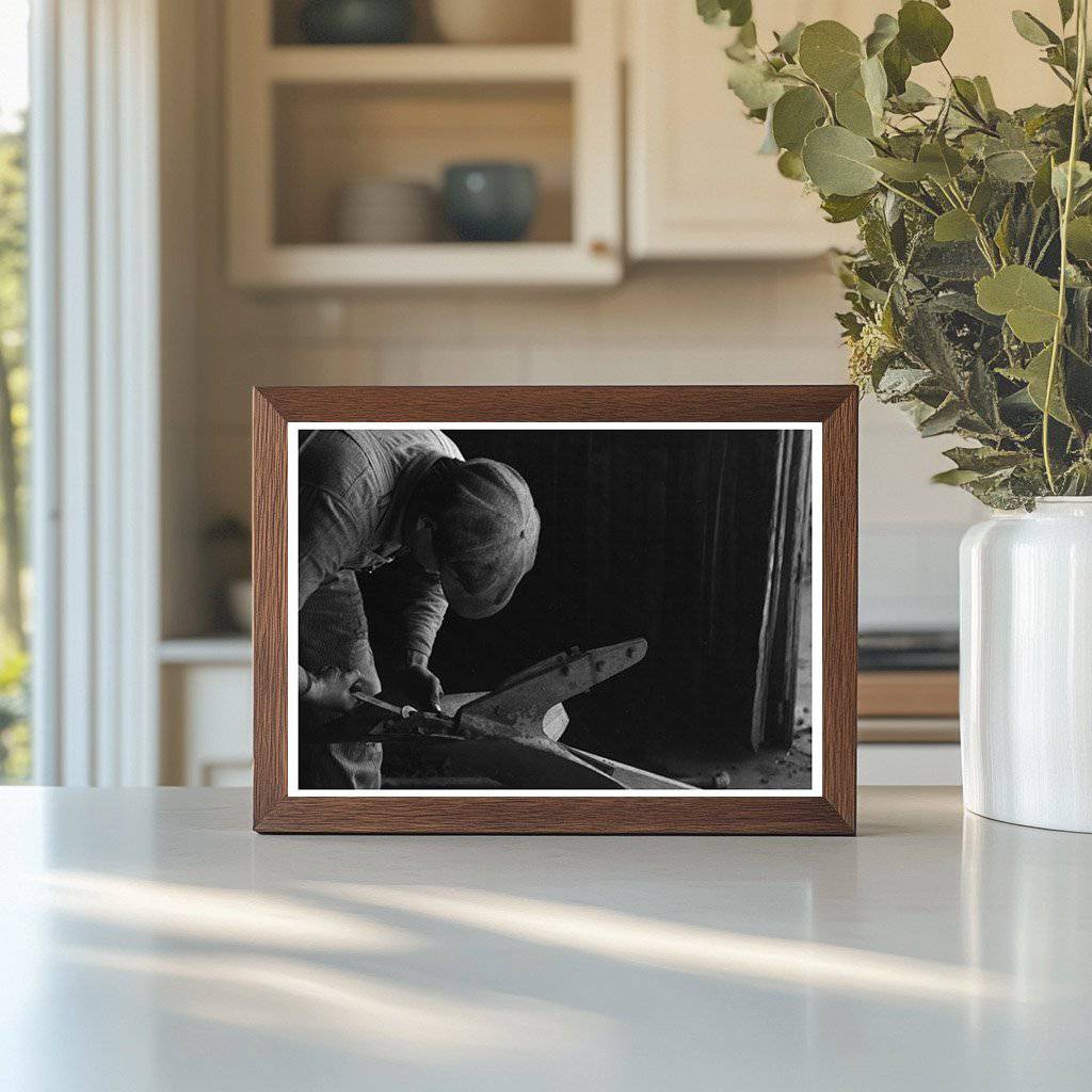 Blacksmith Helper Disassembling Plow Depew Oklahoma 1940 - Available at KNOWOL