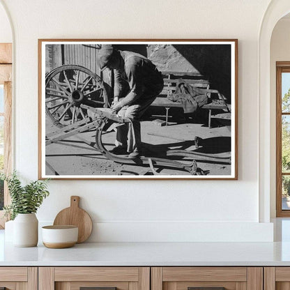 Blacksmith Helper Disassembling Plow February 1940 - Available at KNOWOL