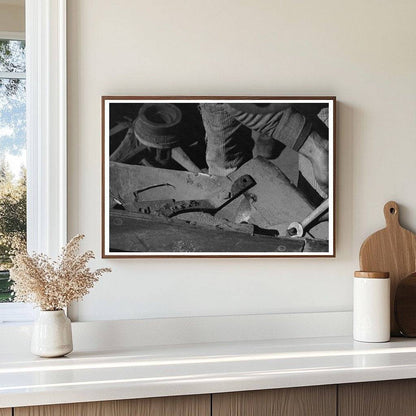 Blacksmiths Helper Disassembling Plow 1940 - Available at KNOWOL