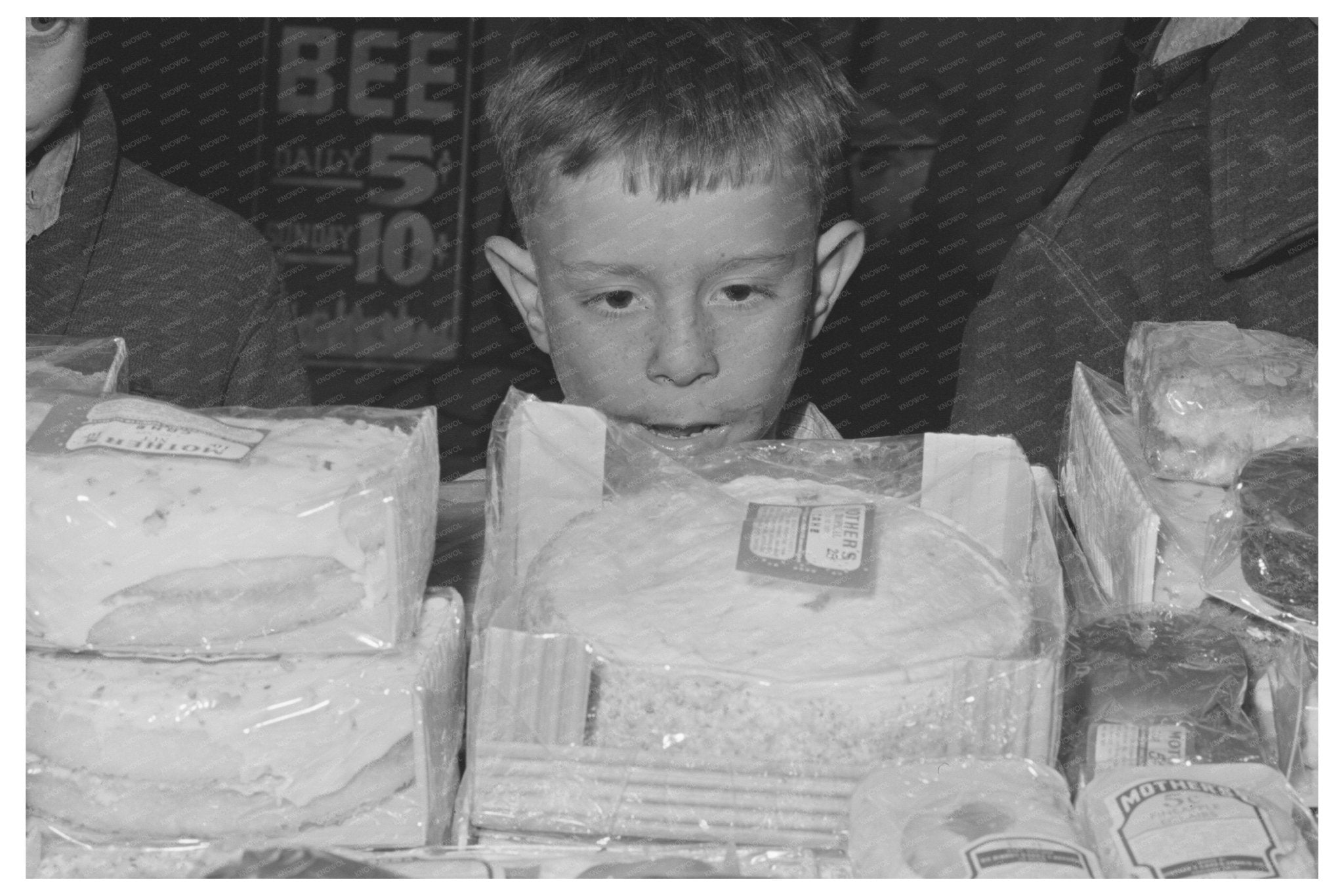 Boys Watching Cakes in FSA Store Woodville California 1942 - Available at KNOWOL