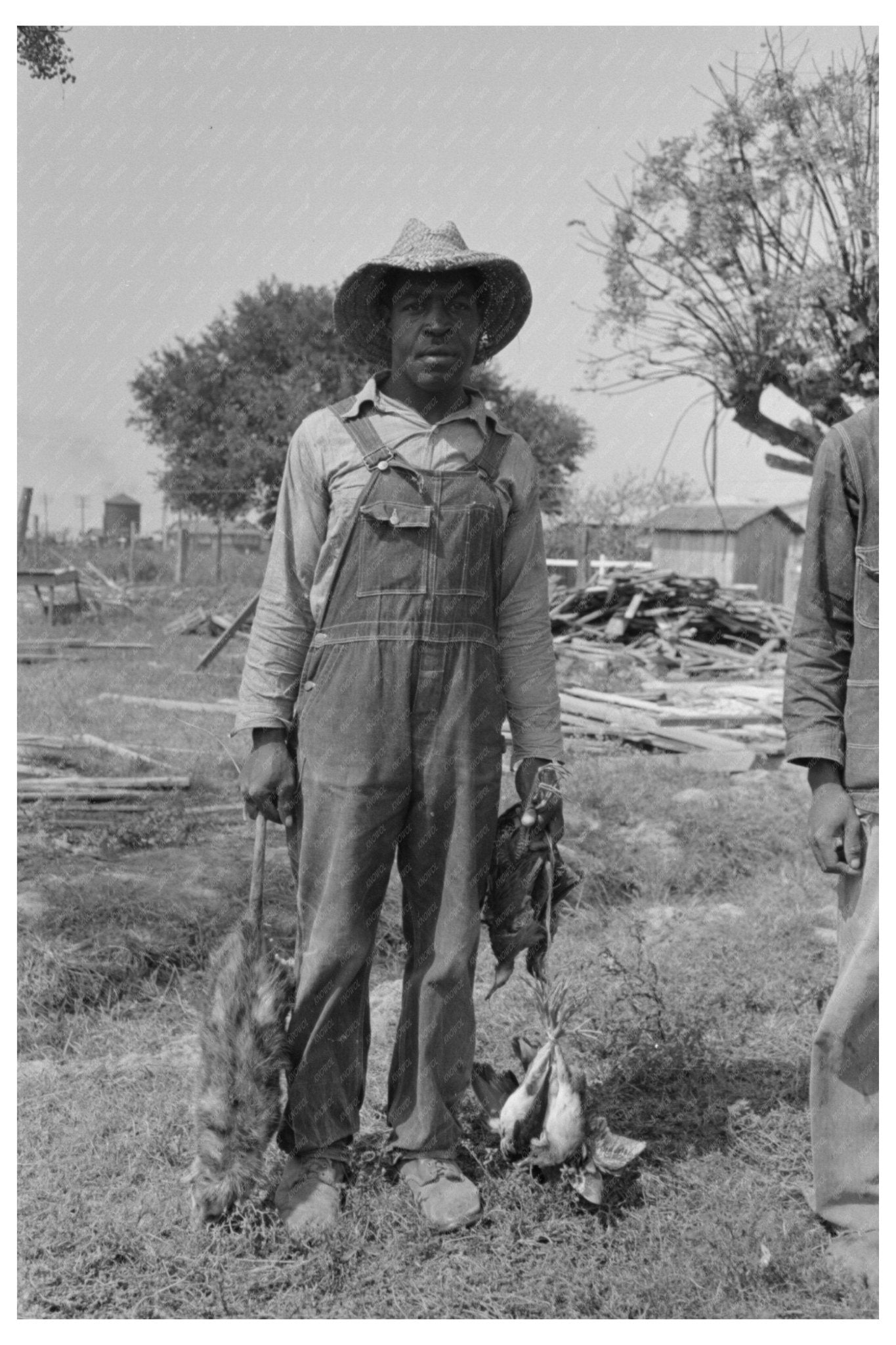 Cajun Laborers with Game in Crowley Louisiana 1938 - Available at KNOWOL