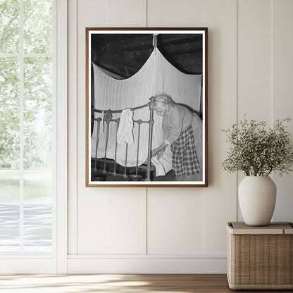 Cajun Woman Tucking Mosquito Bar Crowley Louisiana 1938 - Available at KNOWOL