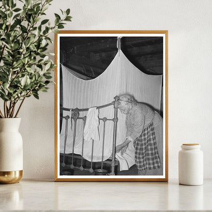 Cajun Woman Tucking Mosquito Bar Crowley Louisiana 1938 - Available at KNOWOL