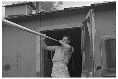 Camp Cook Blowing Dinner Horn at Lumber Camp 1937 - Available at KNOWOL