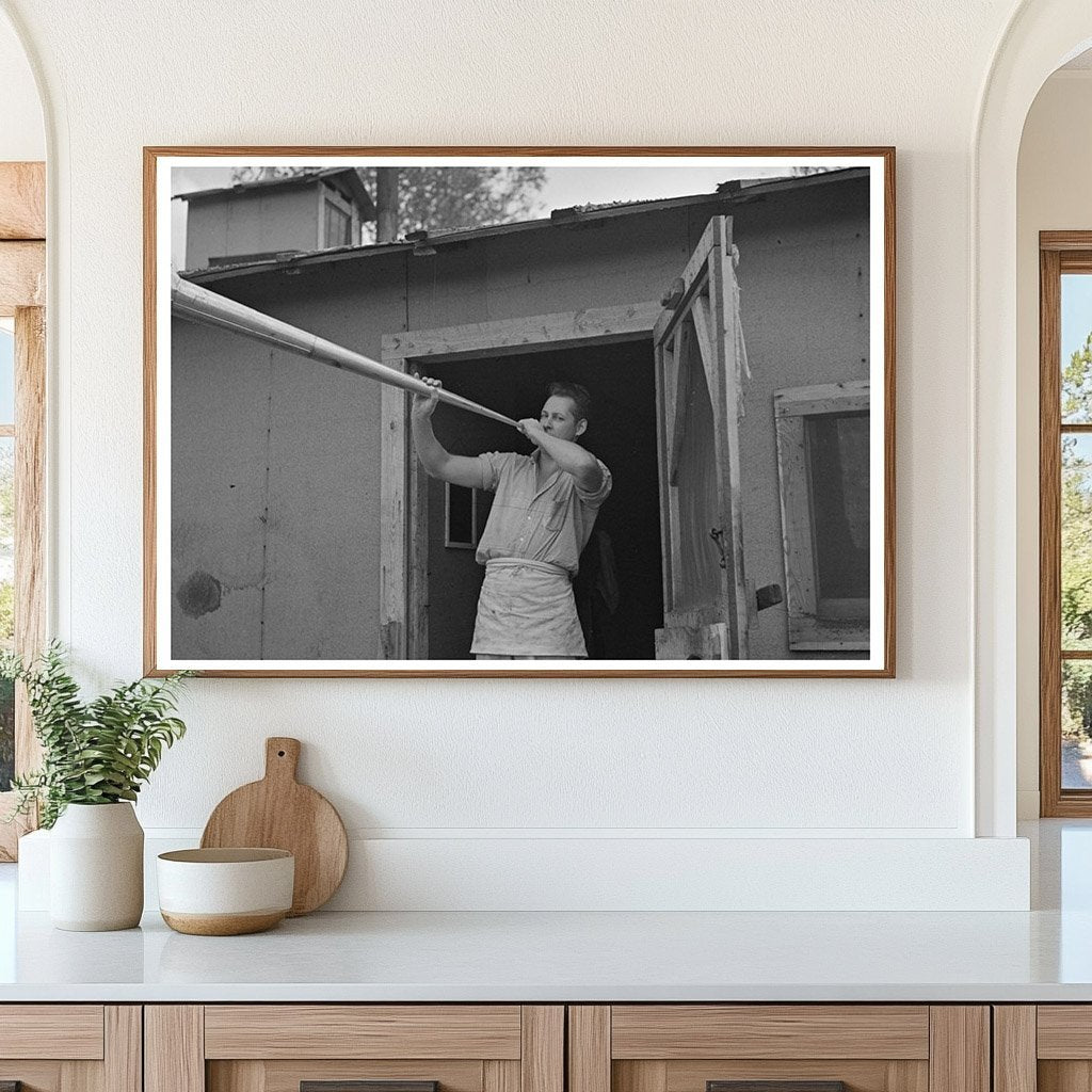 Camp Cook Blowing Dinner Horn at Lumber Camp 1937 - Available at KNOWOL