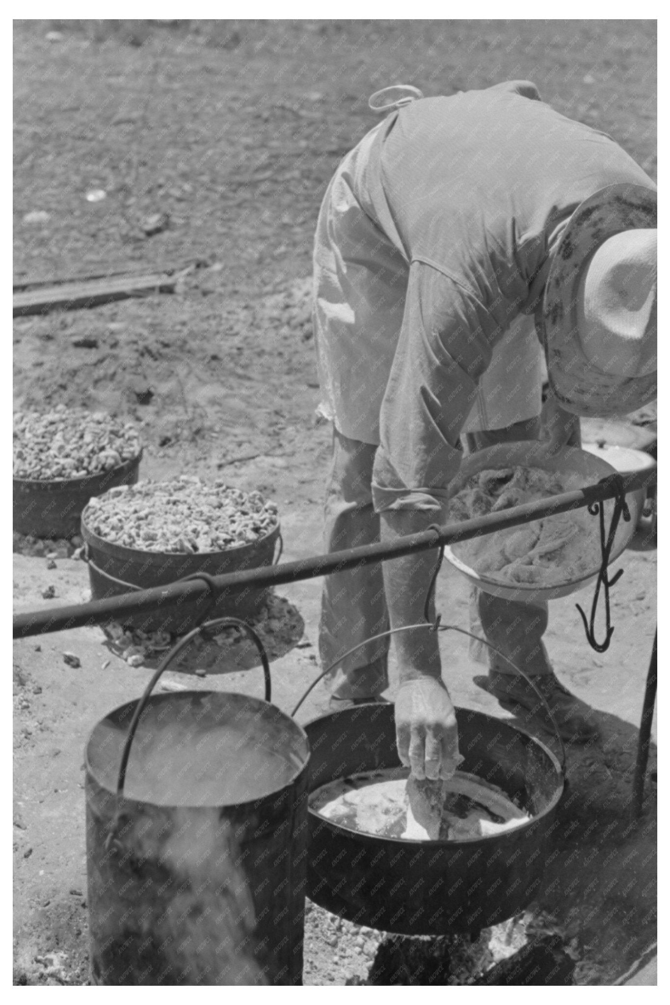 Camp Cook Prepares Meal Over Fire Spur Texas May 1939 - Available at KNOWOL