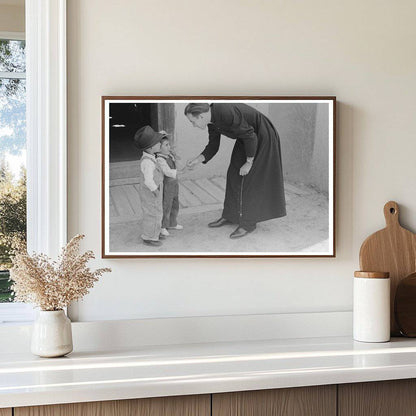 Catholic Priest Greets Boy After Mass Trampas New Mexico 1940 - Available at KNOWOL