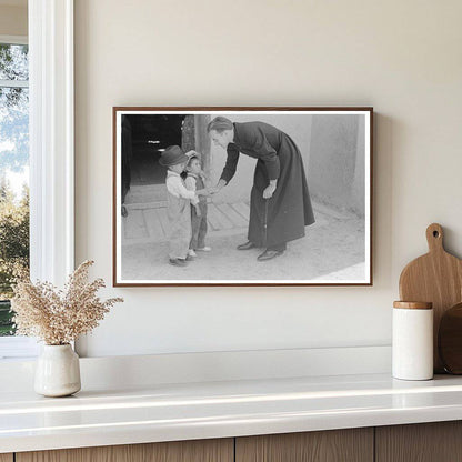 Catholic Priest Greets Boy in Trampas New Mexico 1940 - Available at KNOWOL