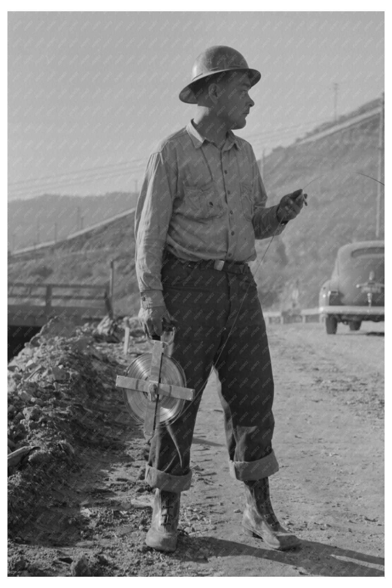 Chain Man Surveying at Shasta Dam California 1941 - Available at KNOWOL