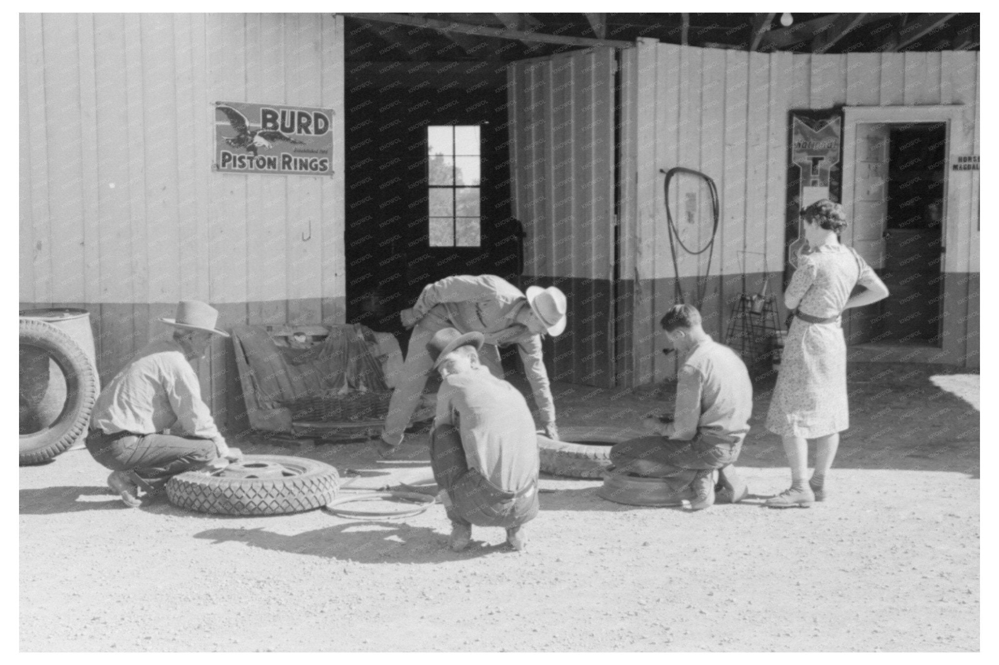 Changing a Tire in Pie Town New Mexico June 1944 - Available at KNOWOL