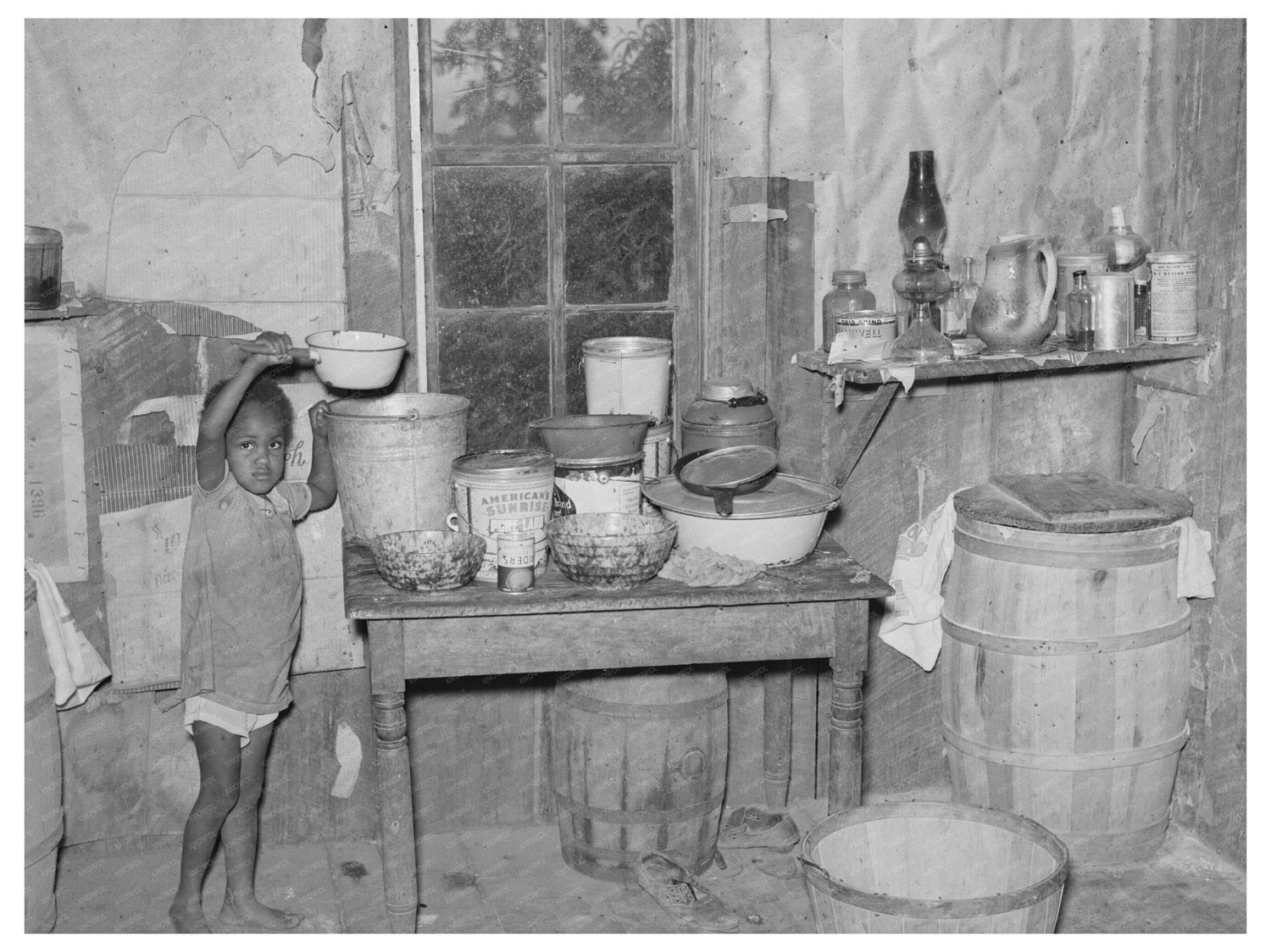 Child Drinking Water in Sharecropper Shack Missouri 1938 - Available at KNOWOL