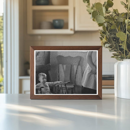 Child in Rocking Chair at Nissen Shack Dickens Iowa 1936 - Available at KNOWOL