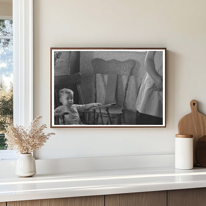 Child in Rocking Chair at Nissen Shack Dickens Iowa 1936 - Available at KNOWOL