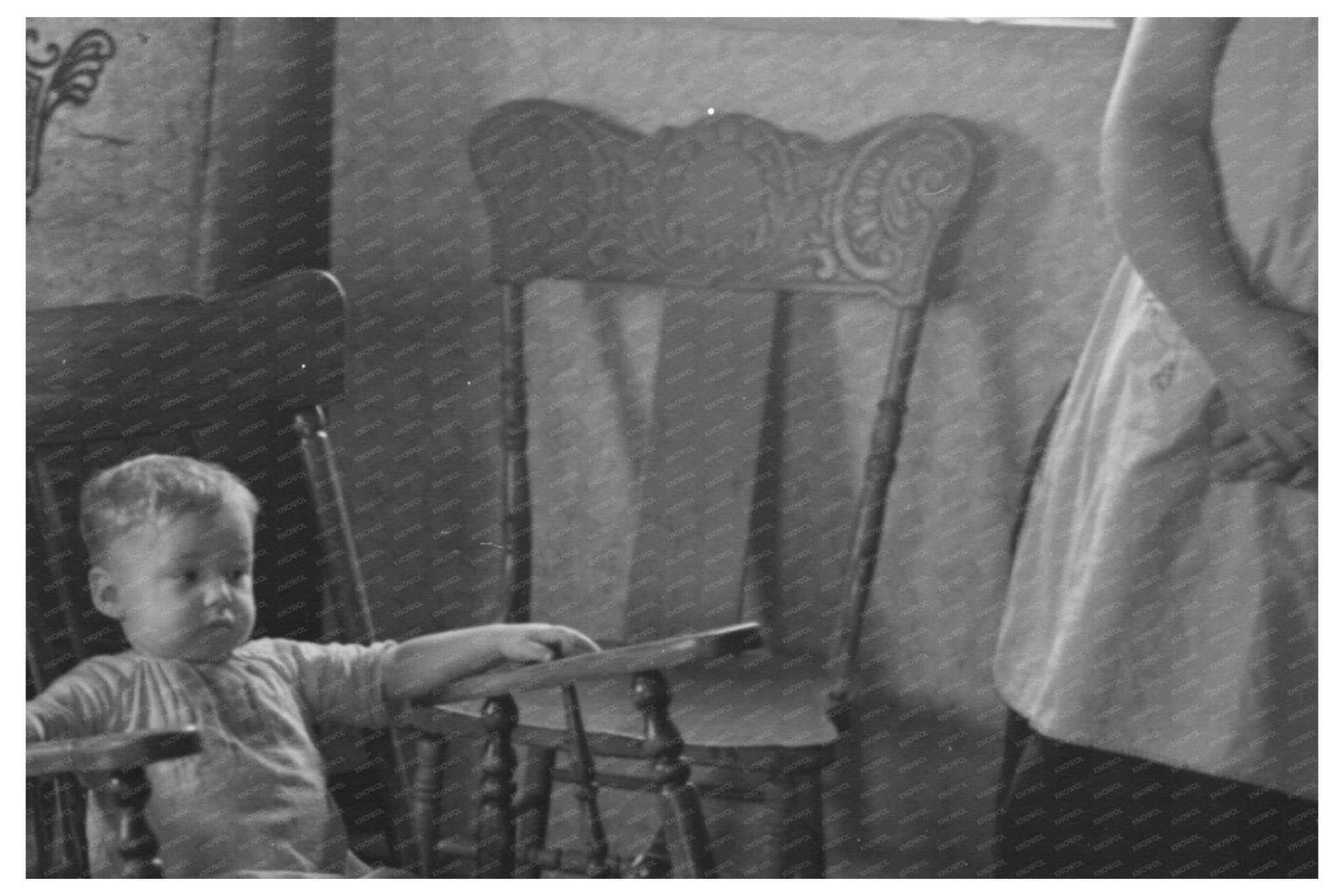 Child in Rocking Chair at Nissen Shack Dickens Iowa 1936 - Available at KNOWOL