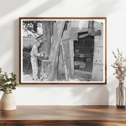 Child Laborer Washing Up in Tent Home 1939 - Available at KNOWOL