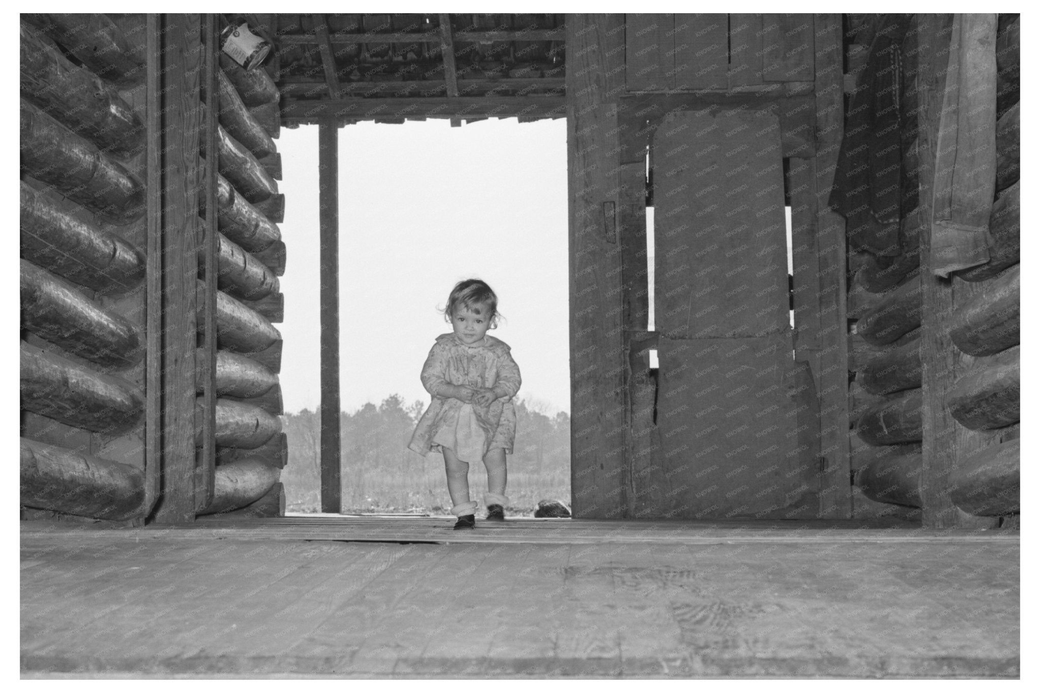 Child of Sharecropper Near Dog Trot Cabin Laurel 1939 - Available at KNOWOL