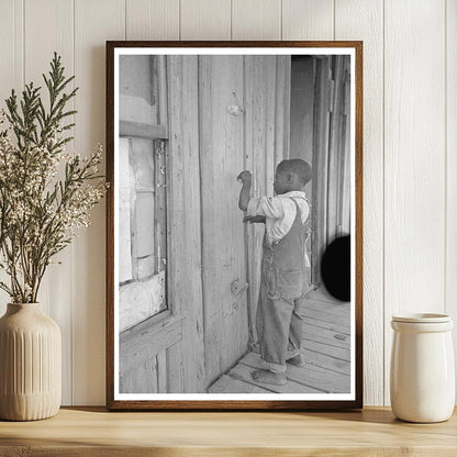 Child Playing Primitive Instrument in New Madrid County 1938 - Available at KNOWOL