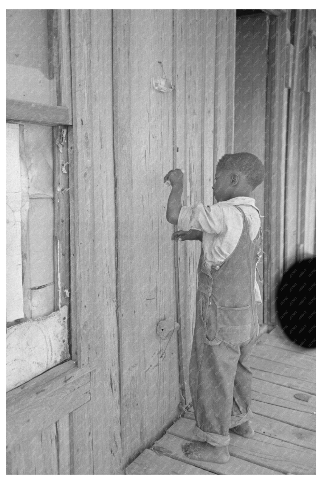 Child Playing Primitive Instrument in New Madrid County 1938 - Available at KNOWOL