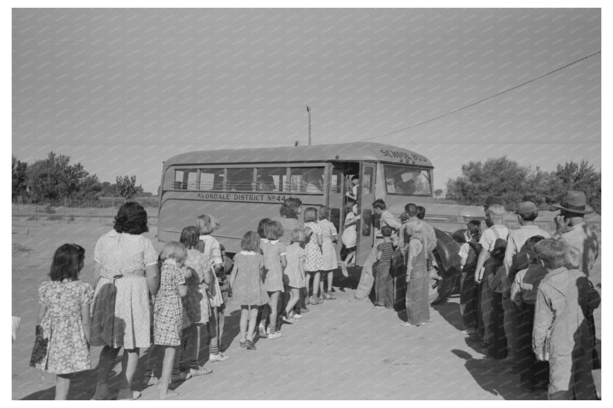 Children Boarding Bus at Agua Fria Labor Camp 1940 - Available at KNOWOL